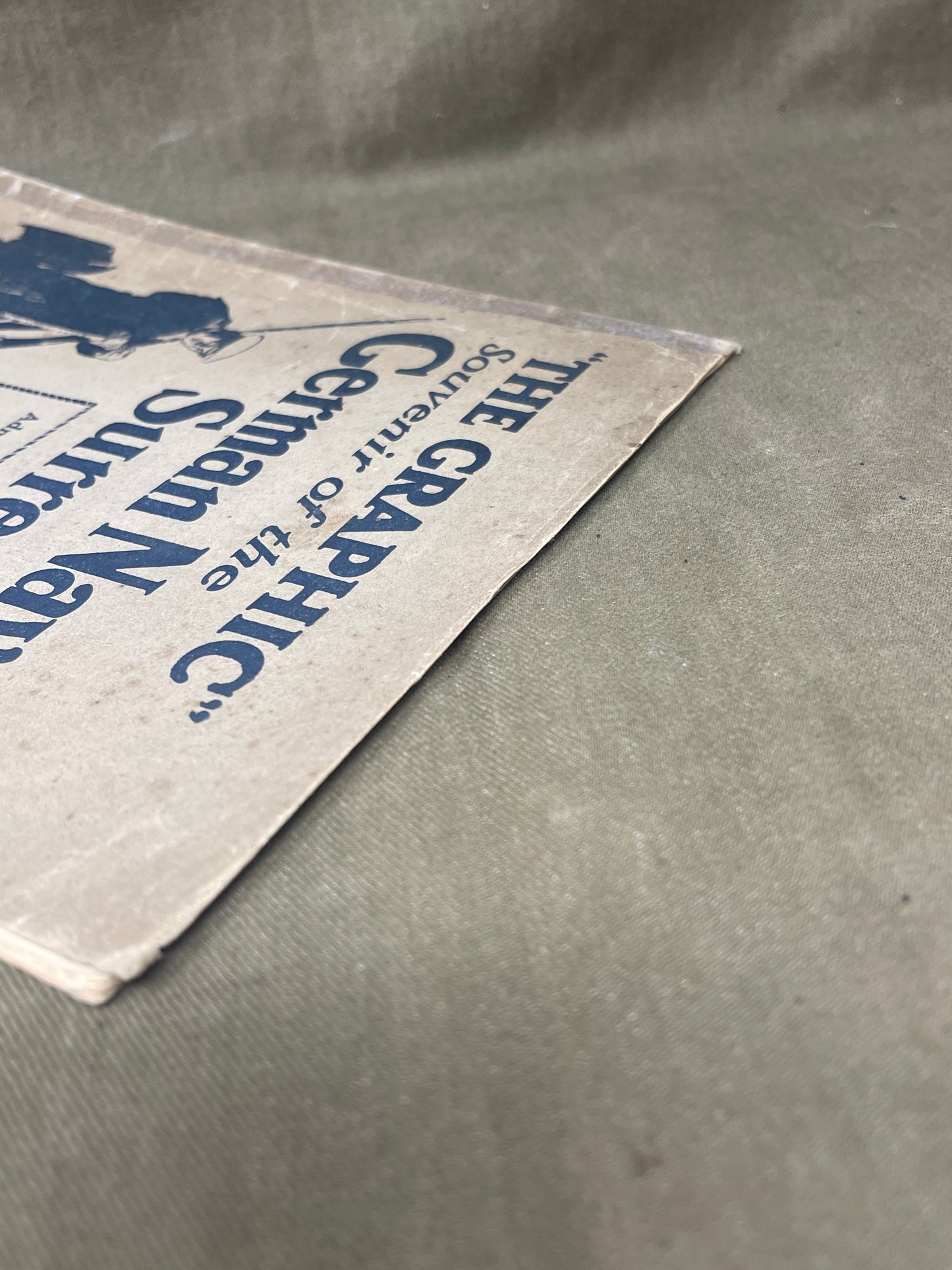 Vintage newspaper or book with text on a textured surface