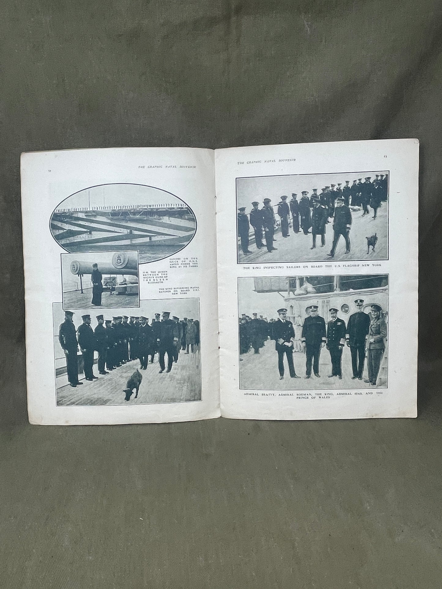 Open book with black and white photographs on a gray background