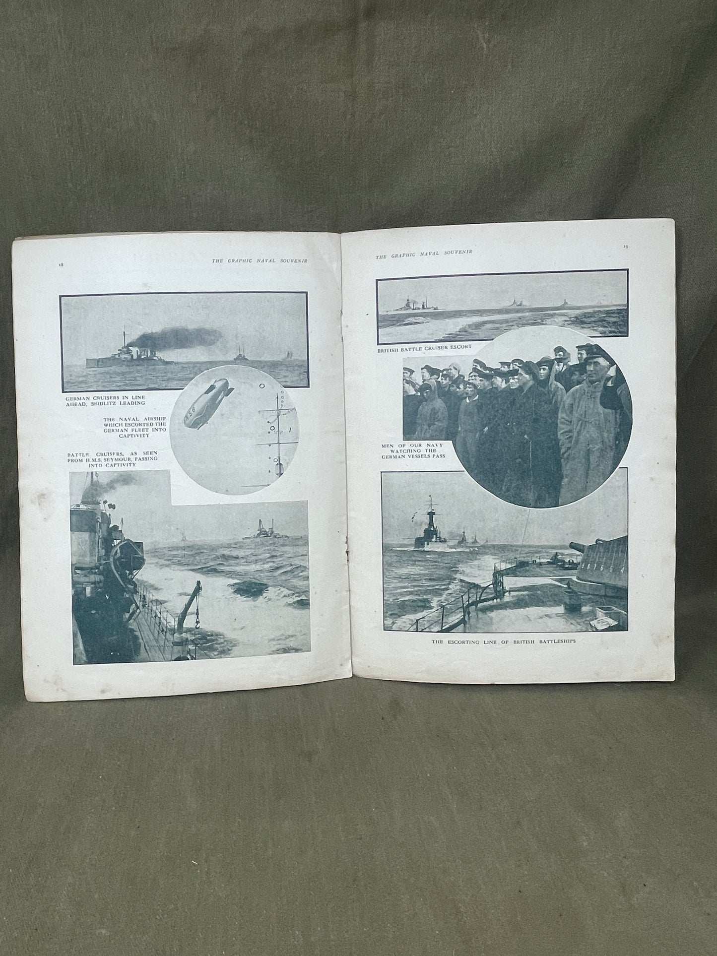 Open book with black and white photographs on a gray background