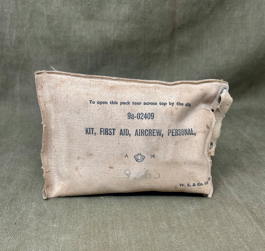Vintage first aid kit for aircrew on a gray background