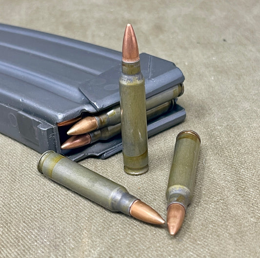 ammunition and magazine on a textured surface