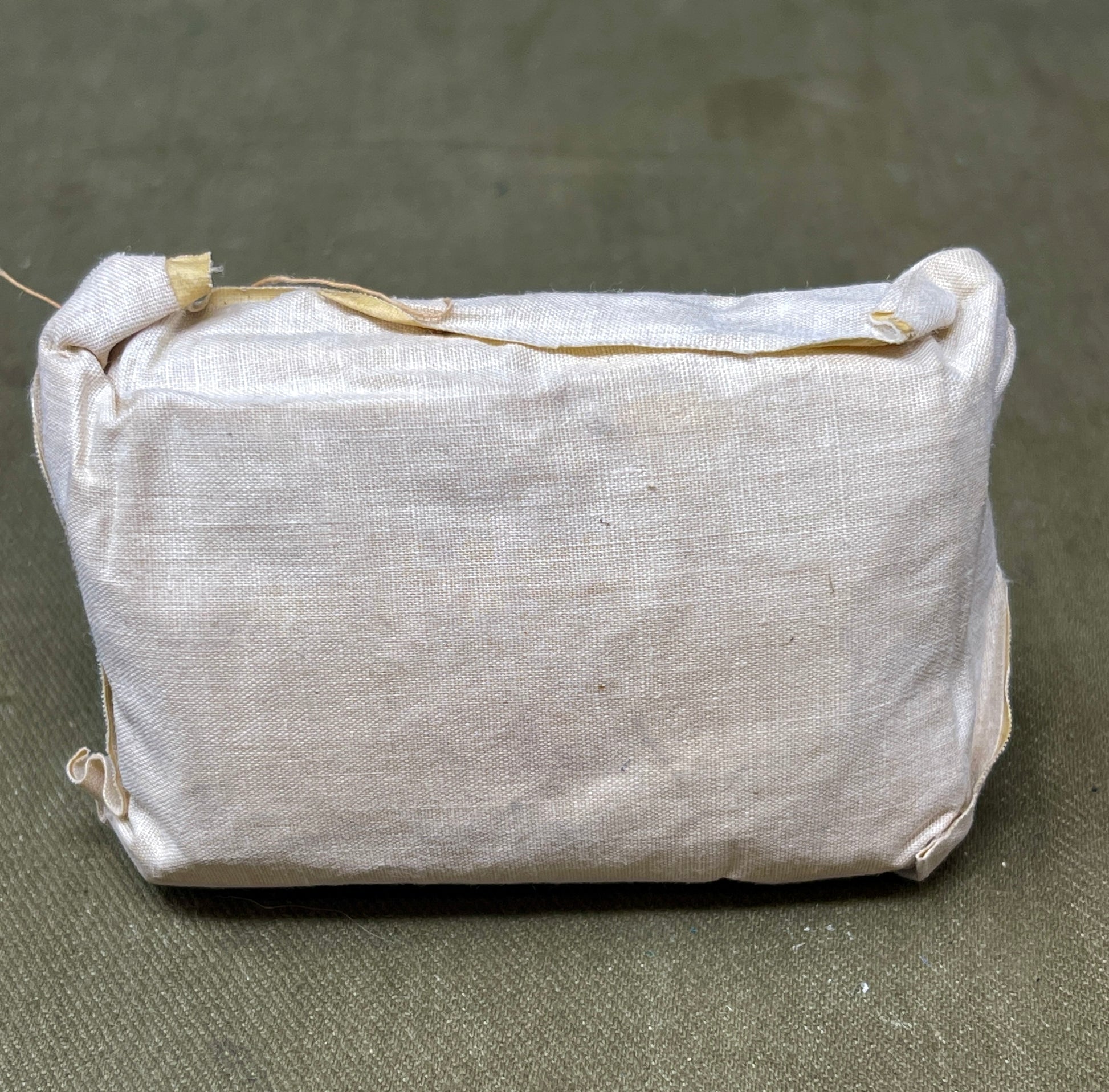 This Large First Aid Dressing, manufactured by T.J. Smith & Nephew Ltd in Hull, England, is a vintage medical supply that highlights the craftsmanship and practical design of mid-20th-century healthcare essentials. Known for its reliability and quality, Smith & Nephew was a renowned manufacturer of medical and surgical products, and this dressing reflects their commitment to excellence.
The dressing is designed for emergency use, providing a sterile and absorbent solution for treating wounds, cuts, or inju