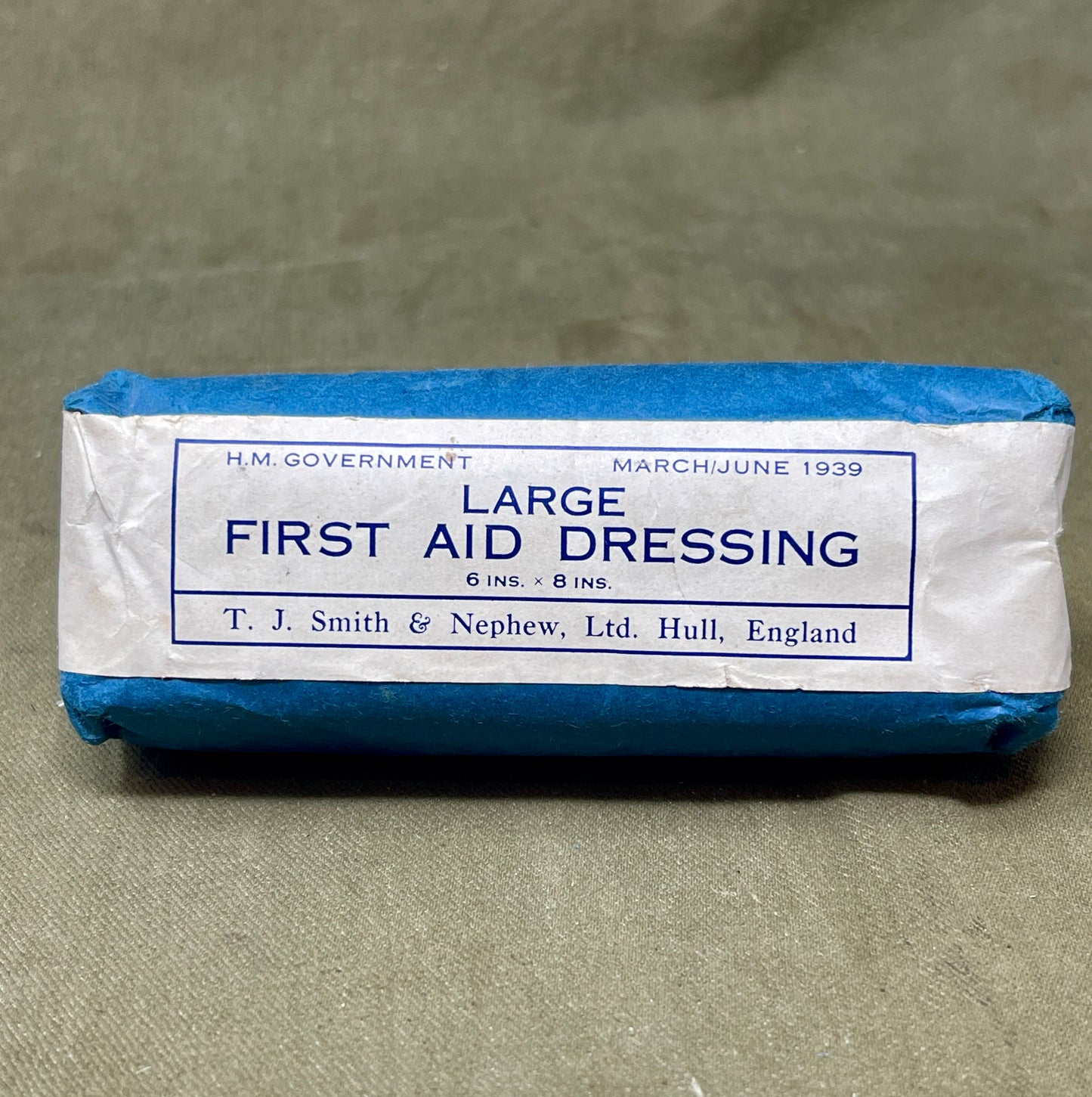 This Large First Aid Dressing, manufactured by T.J. Smith & Nephew Ltd in Hull, England, is a vintage medical supply that highlights the craftsmanship and practical design of mid-20th-century healthcare essentials. Known for its reliability and quality, Smith & Nephew was a renowned manufacturer of medical and surgical products, and this dressing reflects their commitment to excellence.
The dressing is designed for emergency use, providing a sterile and absorbent solution for treating wounds, cuts, or inju