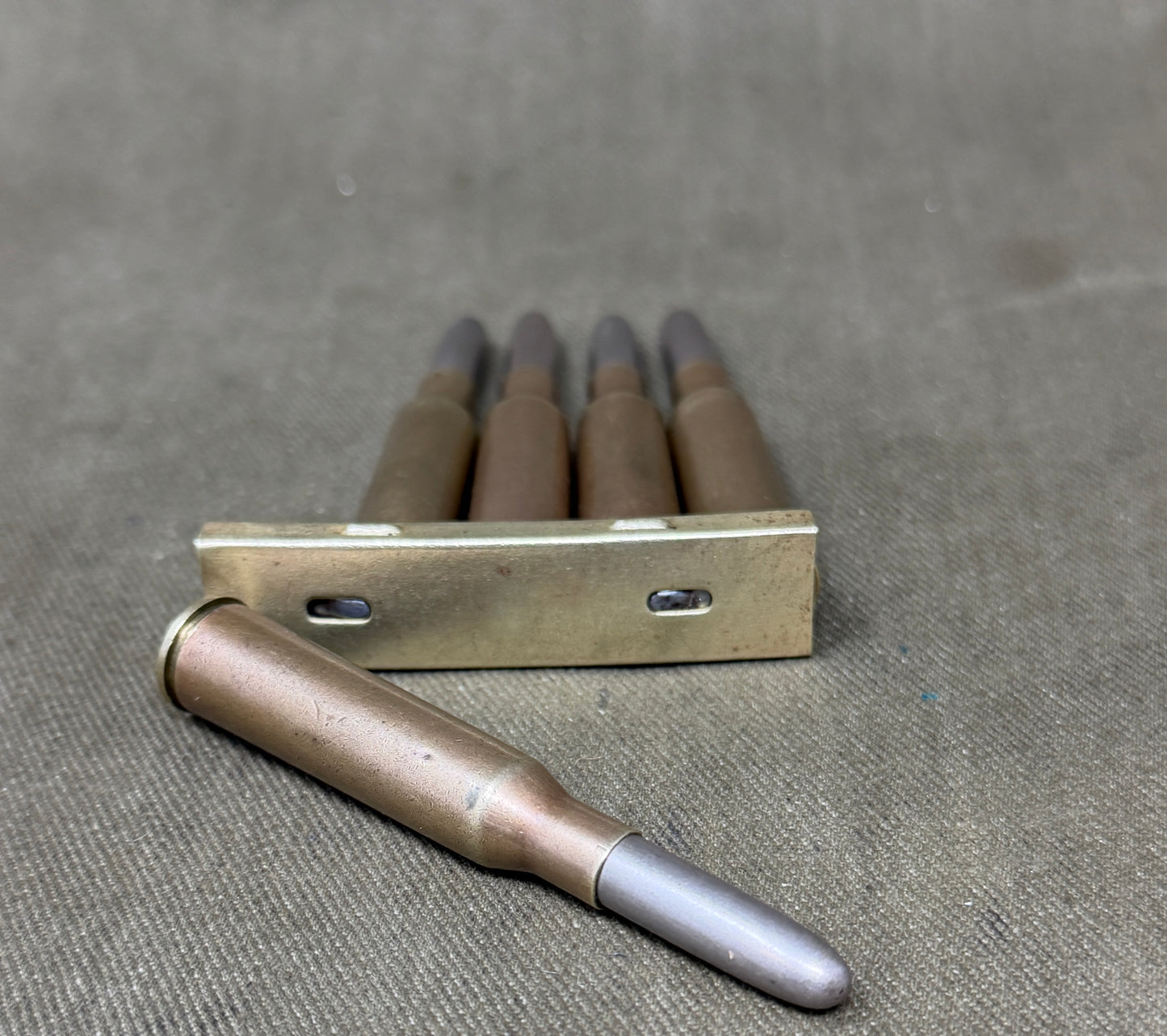 Original Japanese Type 38 Arisaka 6.5mm Inert Rounds on Charger Clip – WW2 / Pre-WW2
