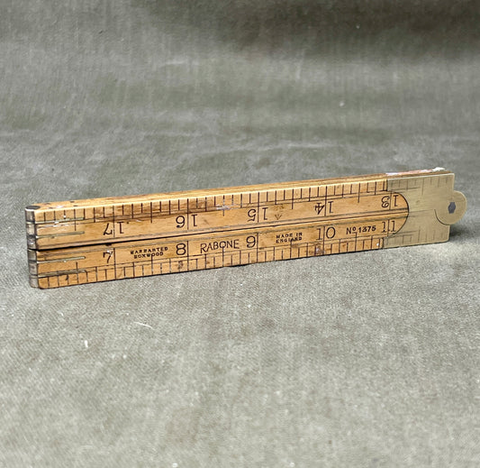 Shop the 1939-dated Rabone No.1375 Boxwood Yard Ruler. A rare, warranted folding ruler made in England—perfect for collectors, woodworkers, and vintage tool lovers.