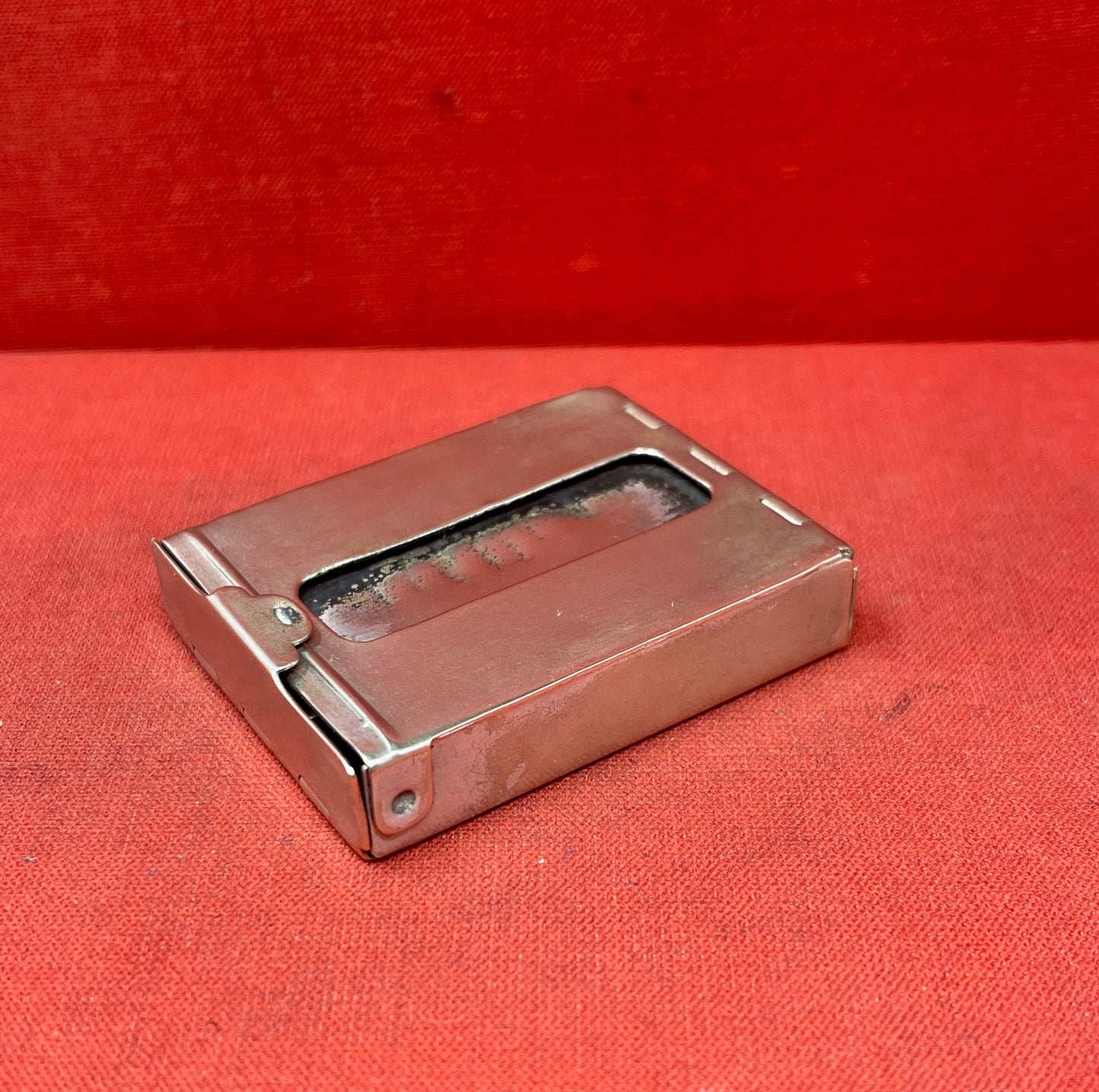 Add a touch of vintage charm to your collection with this original British brass hinged match holder, dating to the 1920s. Crafted from solid brass with a warm aged patina, it features a hinged lid and internal compartment designed to keep matches dry and ready for use. Compact and practical, it would have been a common pocket or travel item in the early 20th century. Ideal for collectors of antique smoking accessories, vintage EDC items, or brassware. A beautiful and functional relic from post-WWI Britain,