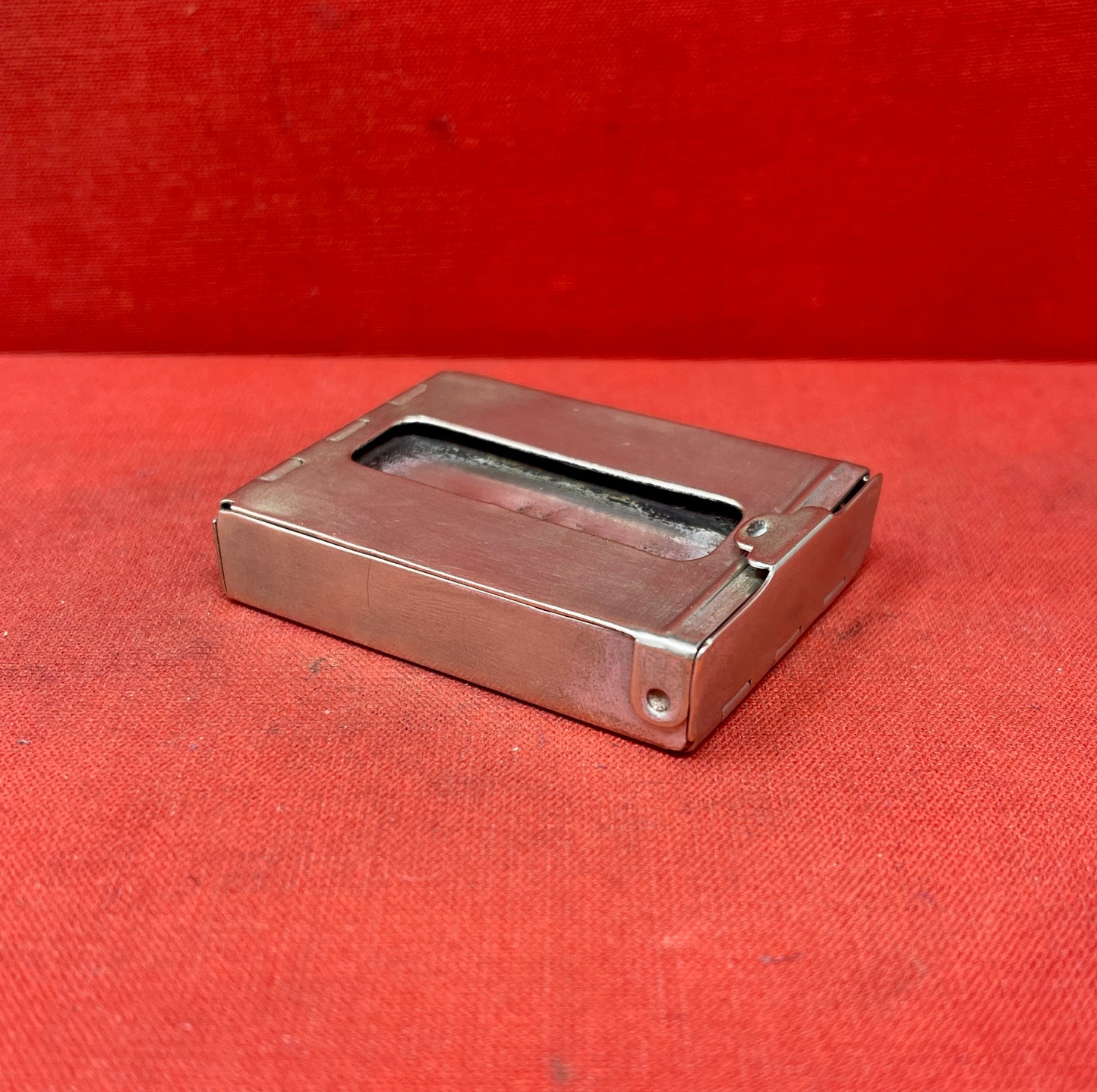 Add a touch of vintage charm to your collection with this original British brass hinged match holder, dating to the 1920s. Crafted from solid brass with a warm aged patina, it features a hinged lid and internal compartment designed to keep matches dry and ready for use. Compact and practical, it would have been a common pocket or travel item in the early 20th century. Ideal for collectors of antique smoking accessories, vintage EDC items, or brassware. A beautiful and functional relic from post-WWI Britain,