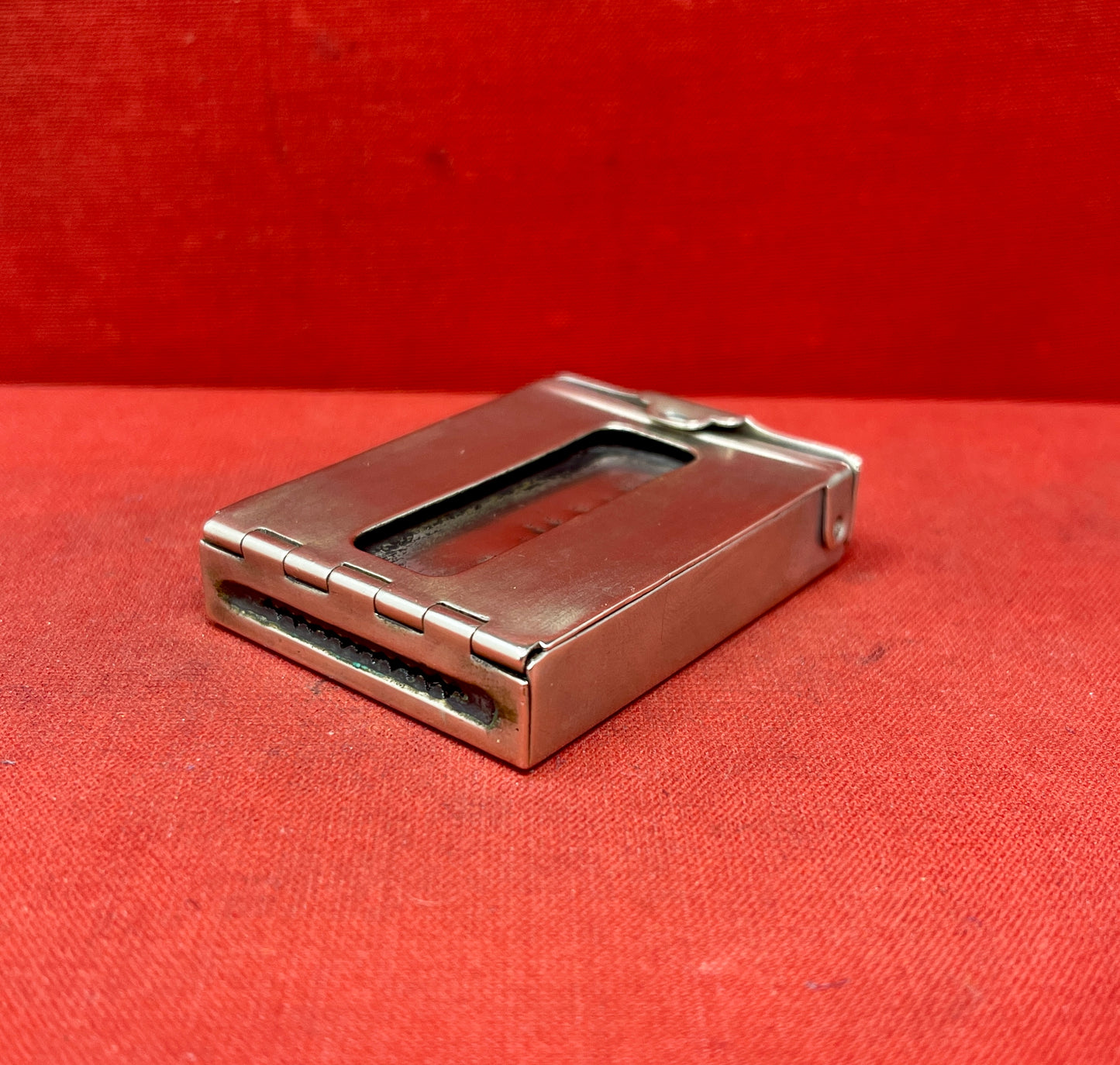 Add a touch of vintage charm to your collection with this original British brass hinged match holder, dating to the 1920s. Crafted from solid brass with a warm aged patina, it features a hinged lid and internal compartment designed to keep matches dry and ready for use. Compact and practical, it would have been a common pocket or travel item in the early 20th century. Ideal for collectors of antique smoking accessories, vintage EDC items, or brassware. A beautiful and functional relic from post-WWI Britain,