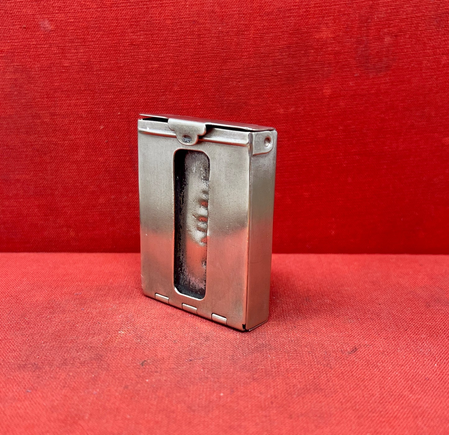 Add a touch of vintage charm to your collection with this original British brass hinged match holder, dating to the 1920s. Crafted from solid brass with a warm aged patina, it features a hinged lid and internal compartment designed to keep matches dry and ready for use. Compact and practical, it would have been a common pocket or travel item in the early 20th century. Ideal for collectors of antique smoking accessories, vintage EDC items, or brassware. A beautiful and functional relic from post-WWI Britain,