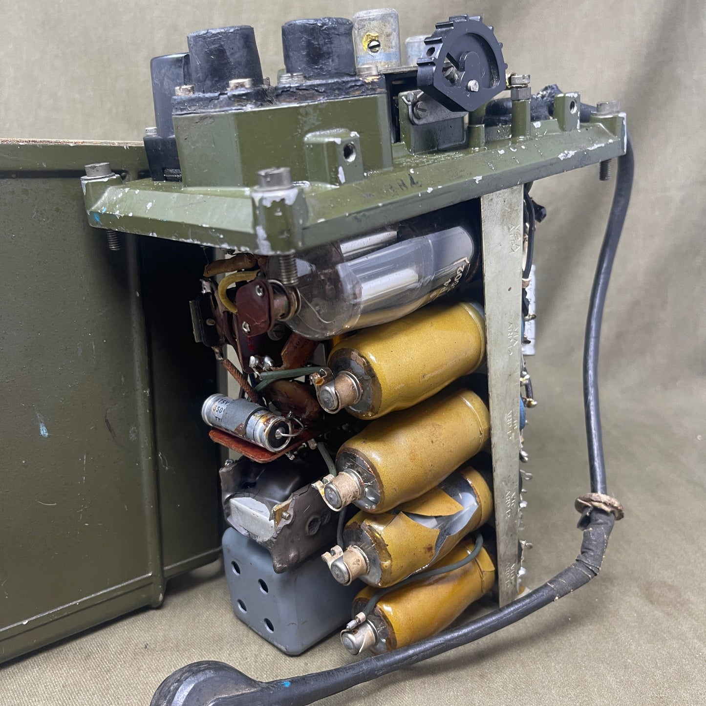 Electrical component with wires and connectors on a beige background