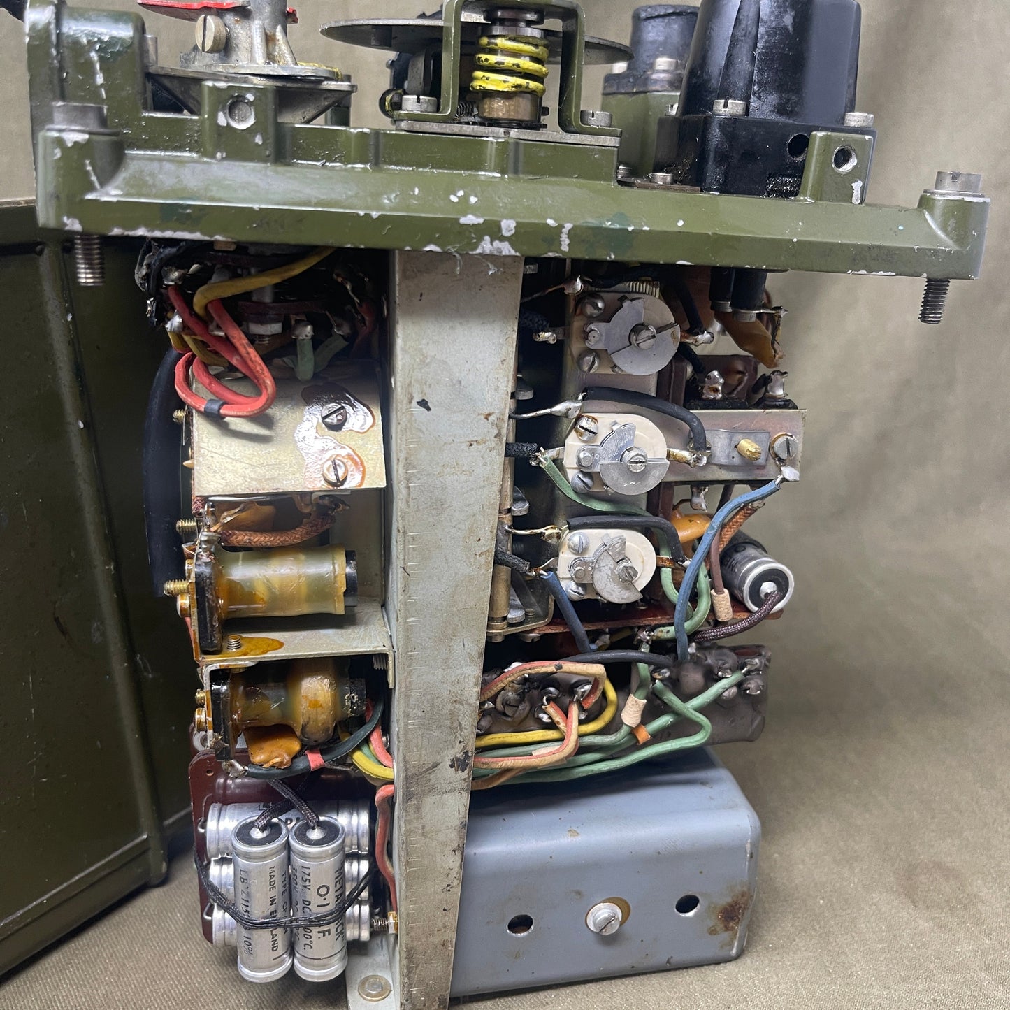 Electrical component with wiring and connectors on a beige background