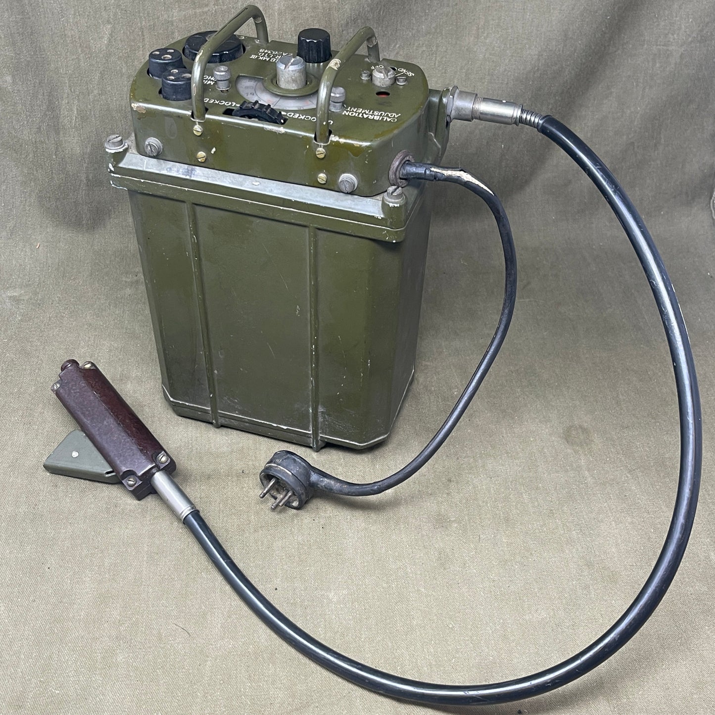 Electrical component with a cable on a beige background