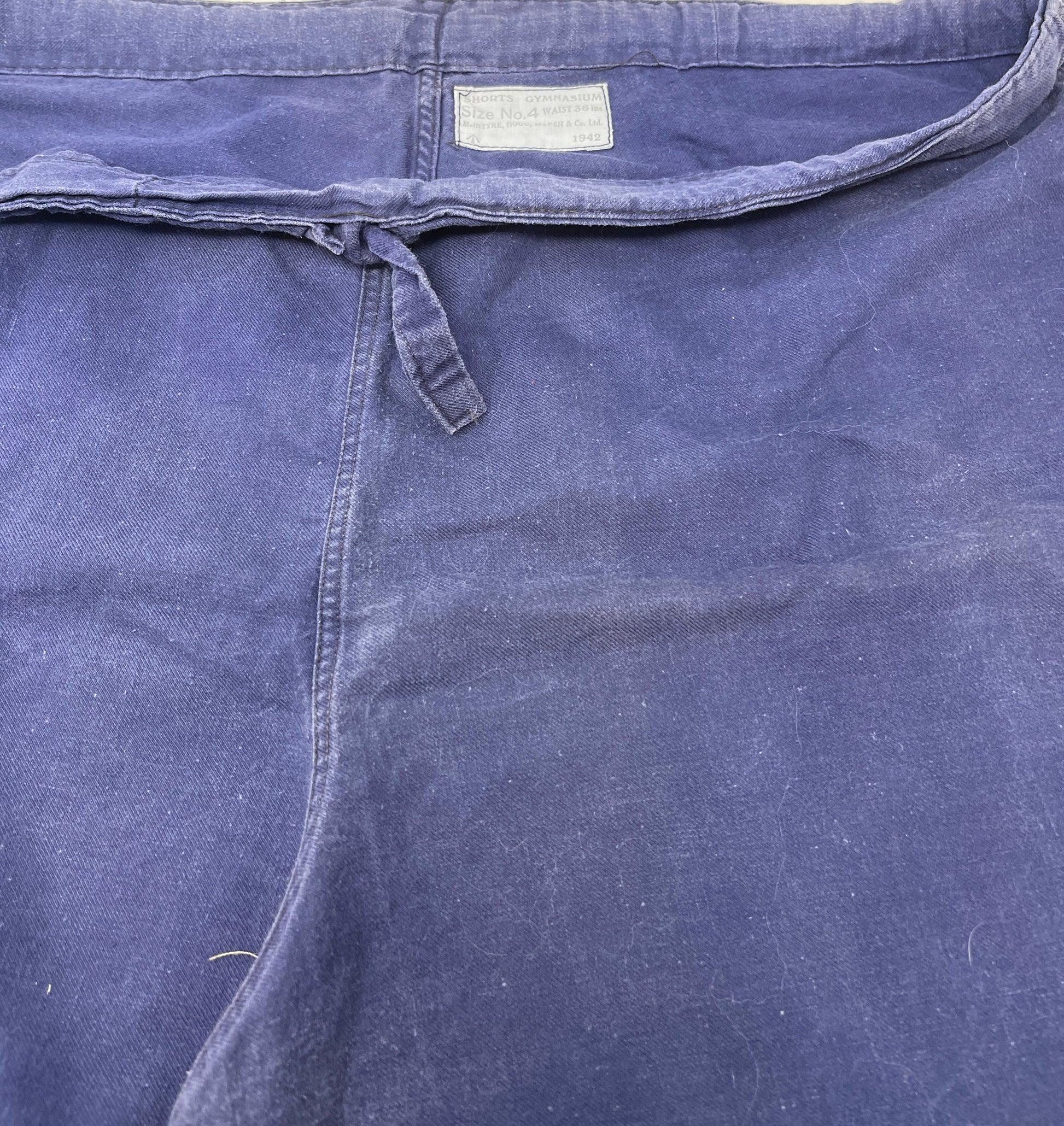 lAbel showing ww2 dated pt shorts