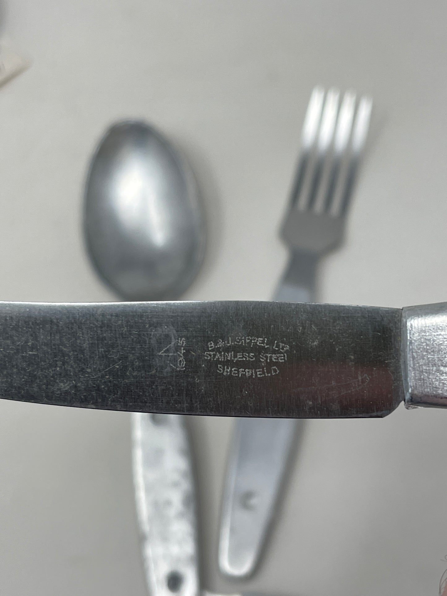 Knife, fork, and spoon set dated 1944