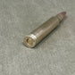 Bullet casing on a textured gray surface