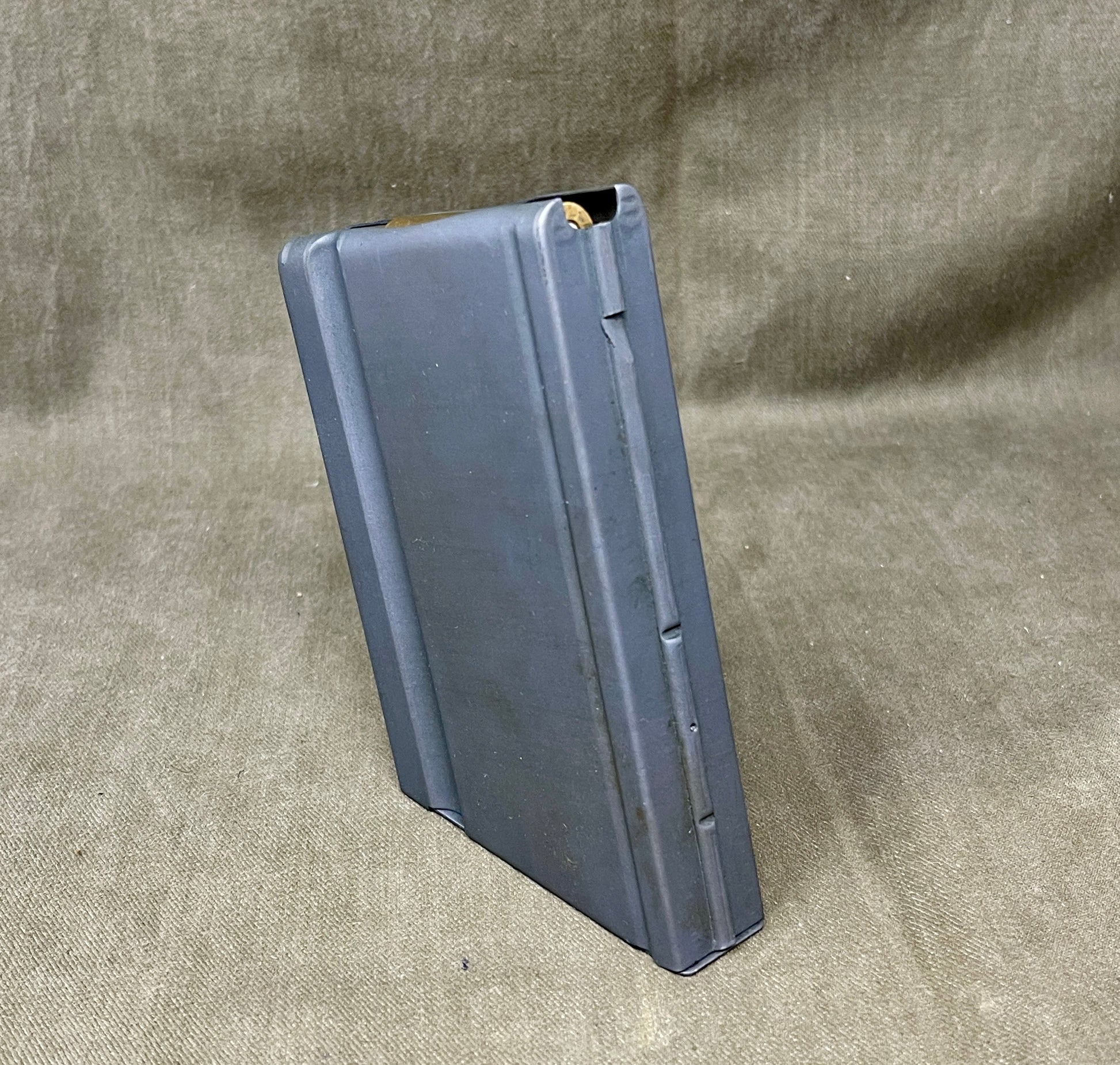 Metal magazine on a textured gray background