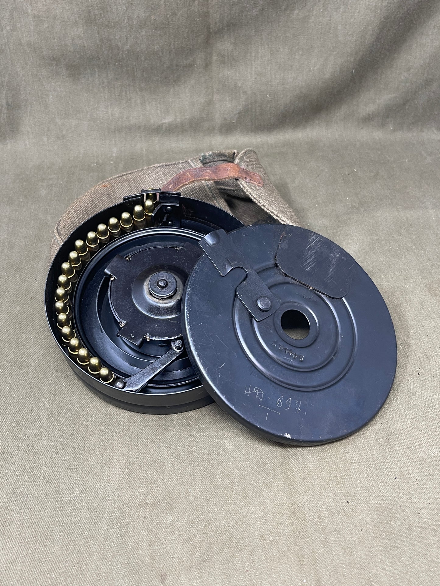 Close-up of a mechanical component on a beige fabric background