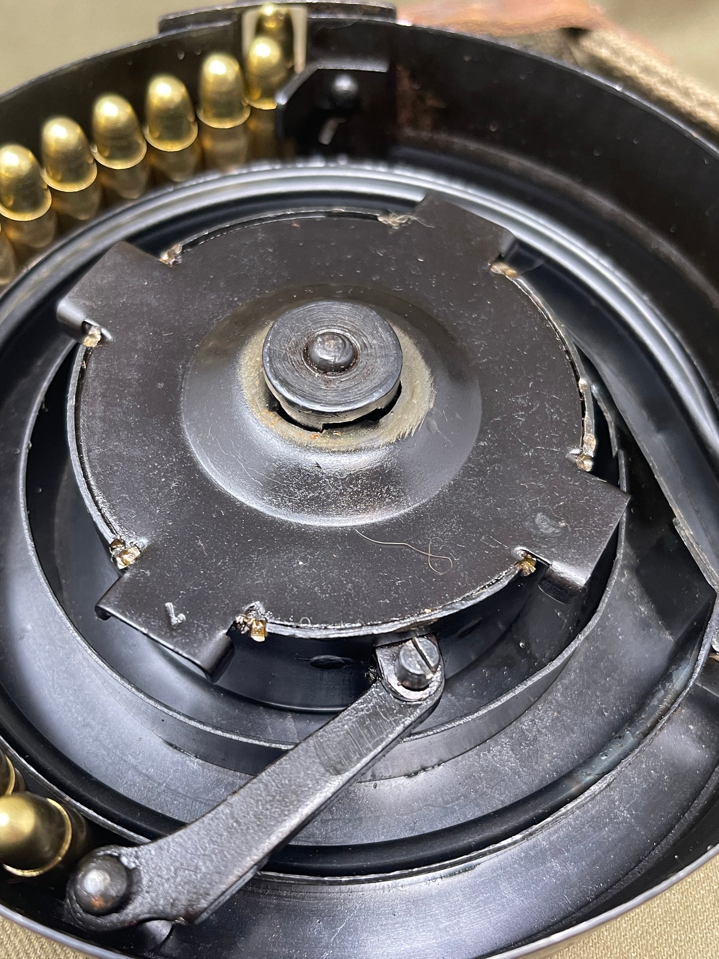 Close-up of a mechanical component with gears and a wrench