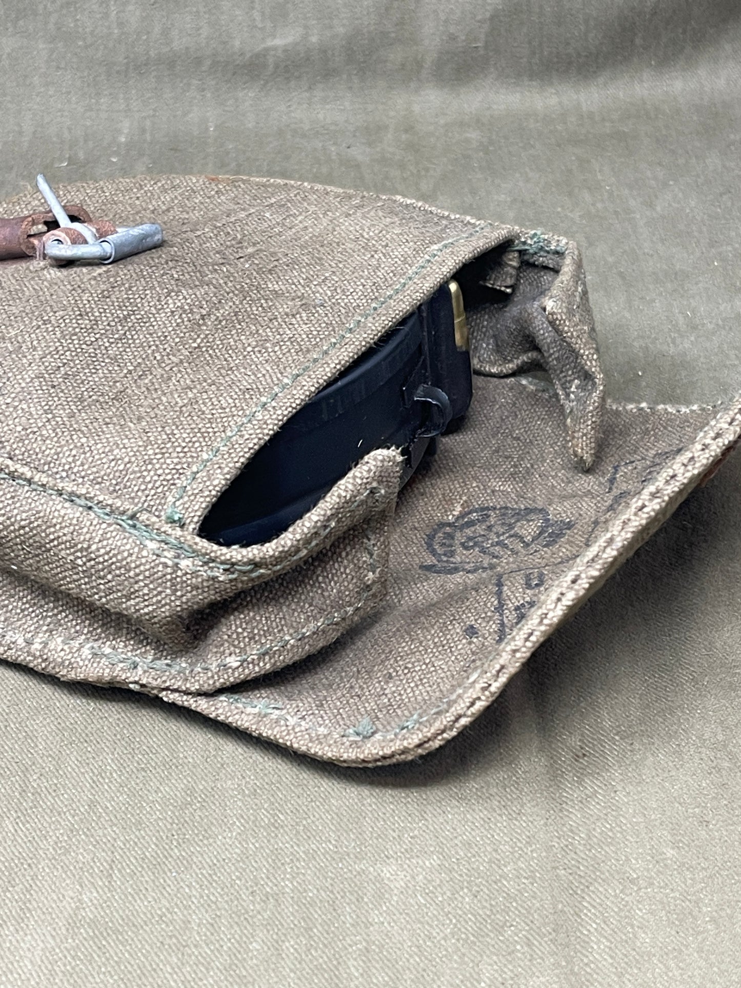 Original Soviet PPSH-41 magazine, professionally fitted with twenty INERT 7.62×25 Tokarev cartridges — an excellent display piece for collectors, museums, and historical reenactors. This authentic magazine displays honest service wear and patina while retaining its original spring and follower, matching period-correct dimensions and finish. Each cartridge is certified inert: they contain no propellant, explosive agents, or hazardous materials, and all primers have been either fired or permanently rendered i