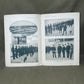 Open book with black and white photographs on a gray background