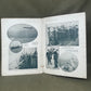 Open book with black and white photographs on a gray surface