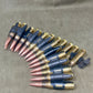 Row of ammunition cartridges on a gray background