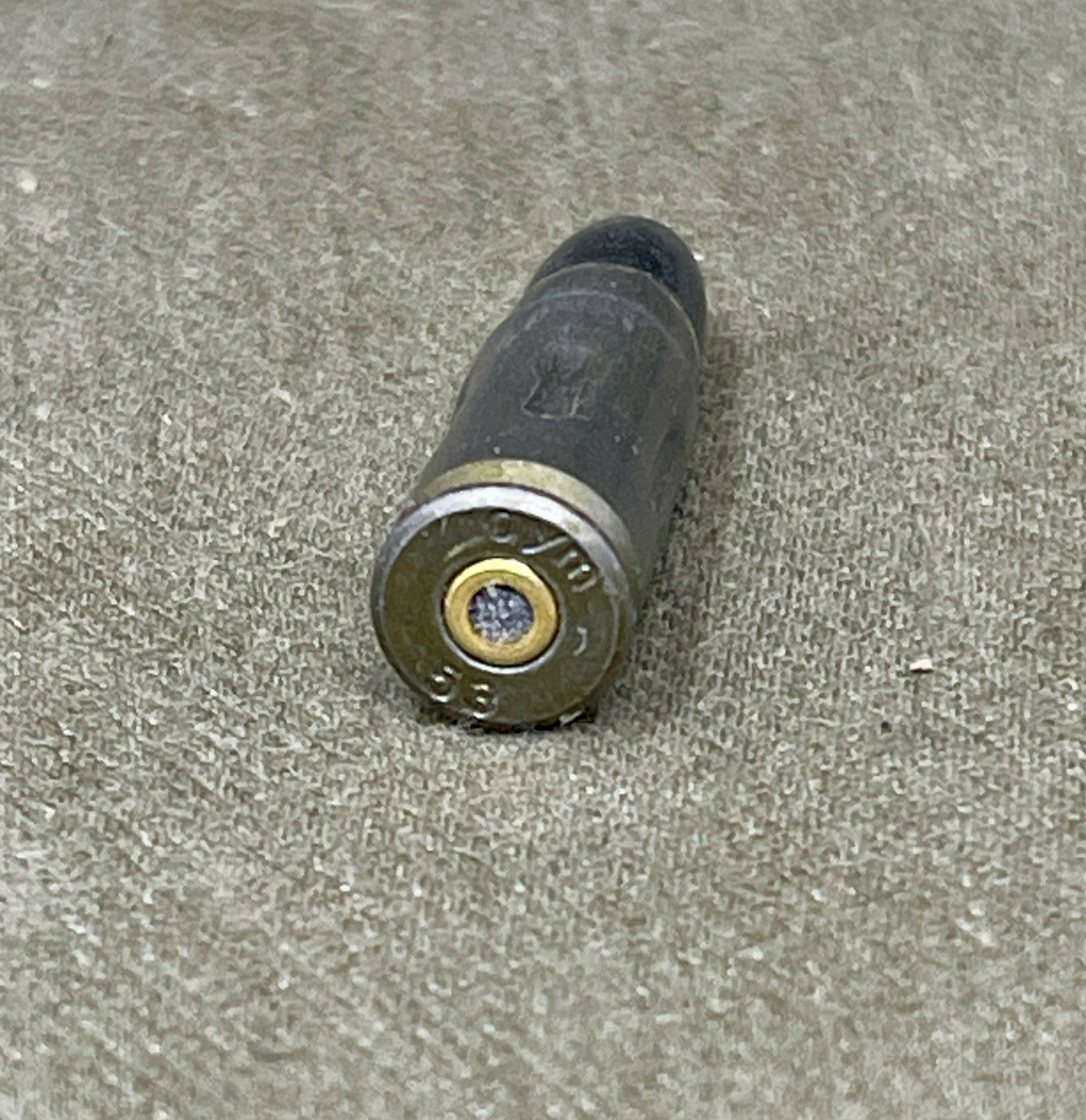 Bullet casing on a textured surface
