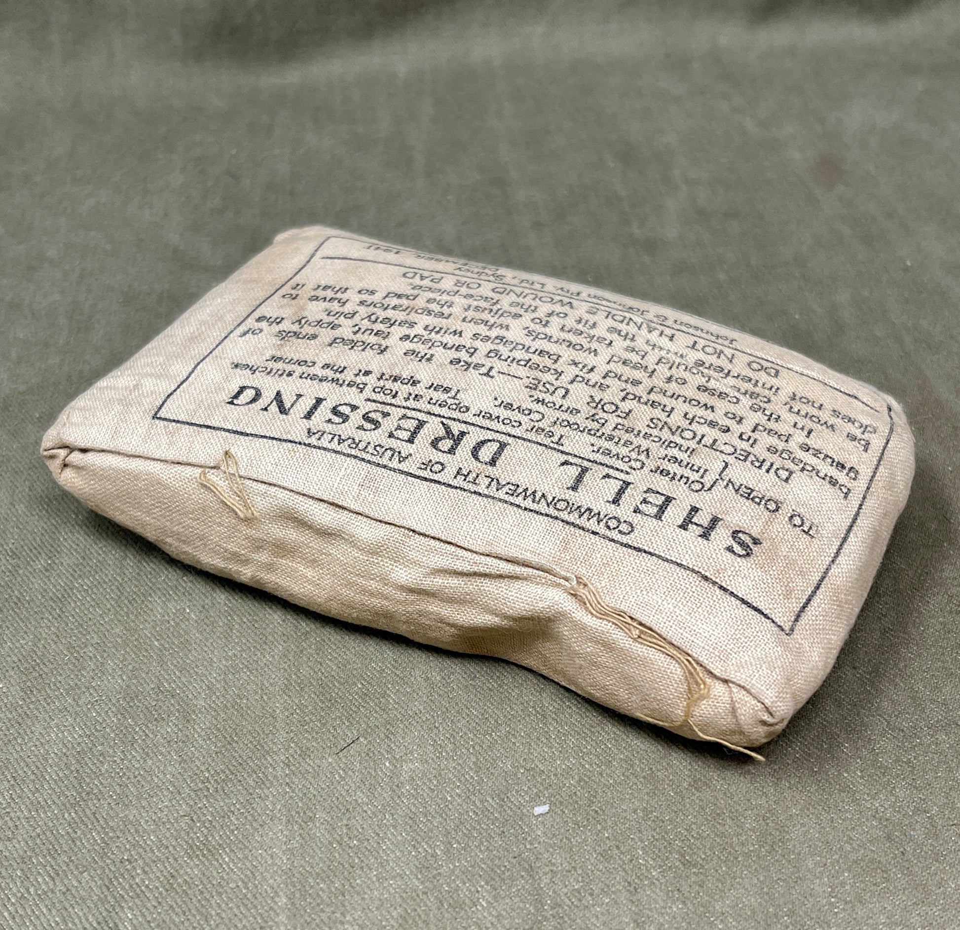 Sheath dressing package with text on a gray background