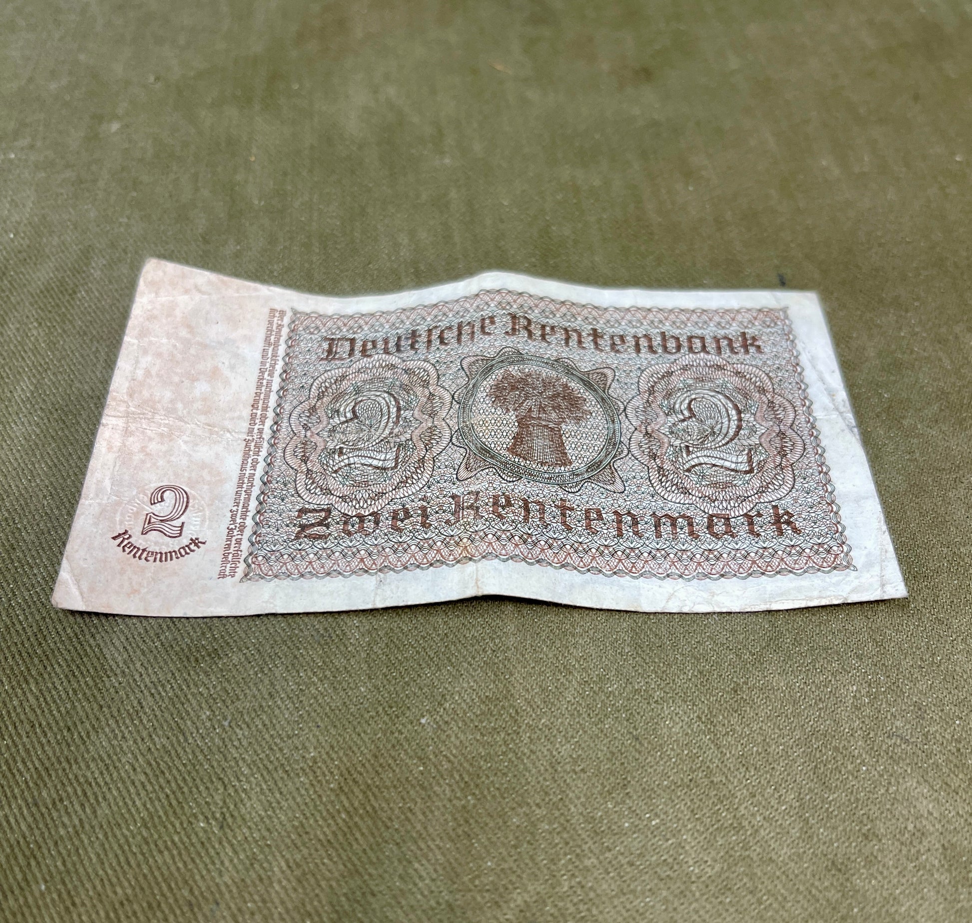 Vintage German banknote from Deutsche Rentenbank on a textured surface