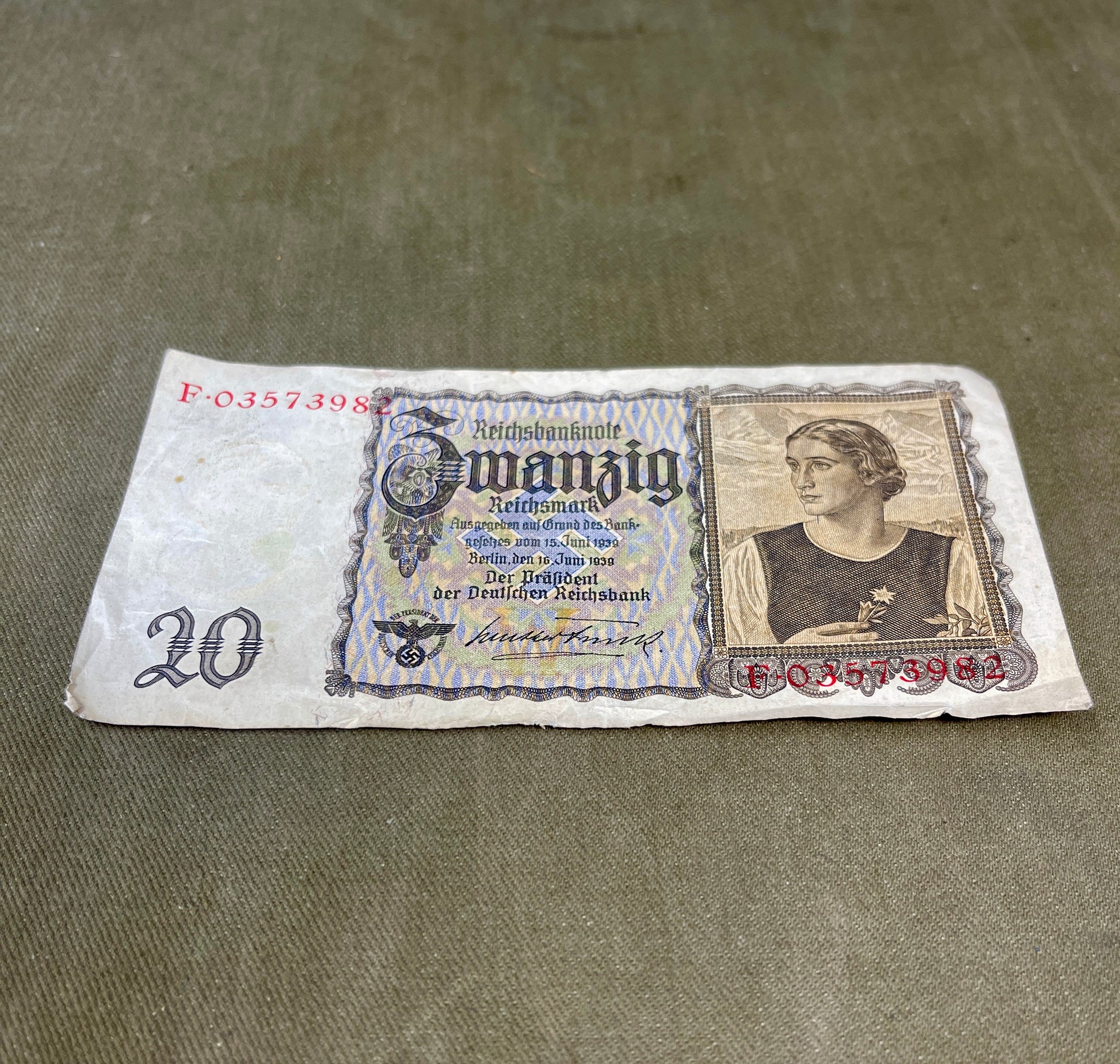 Vintage German banknote with portrait on a textured surface