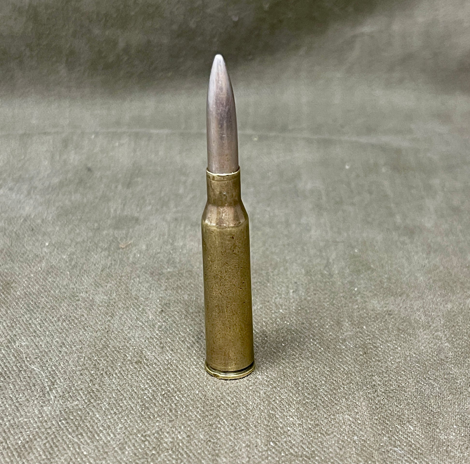Bullet casing on a textured gray background