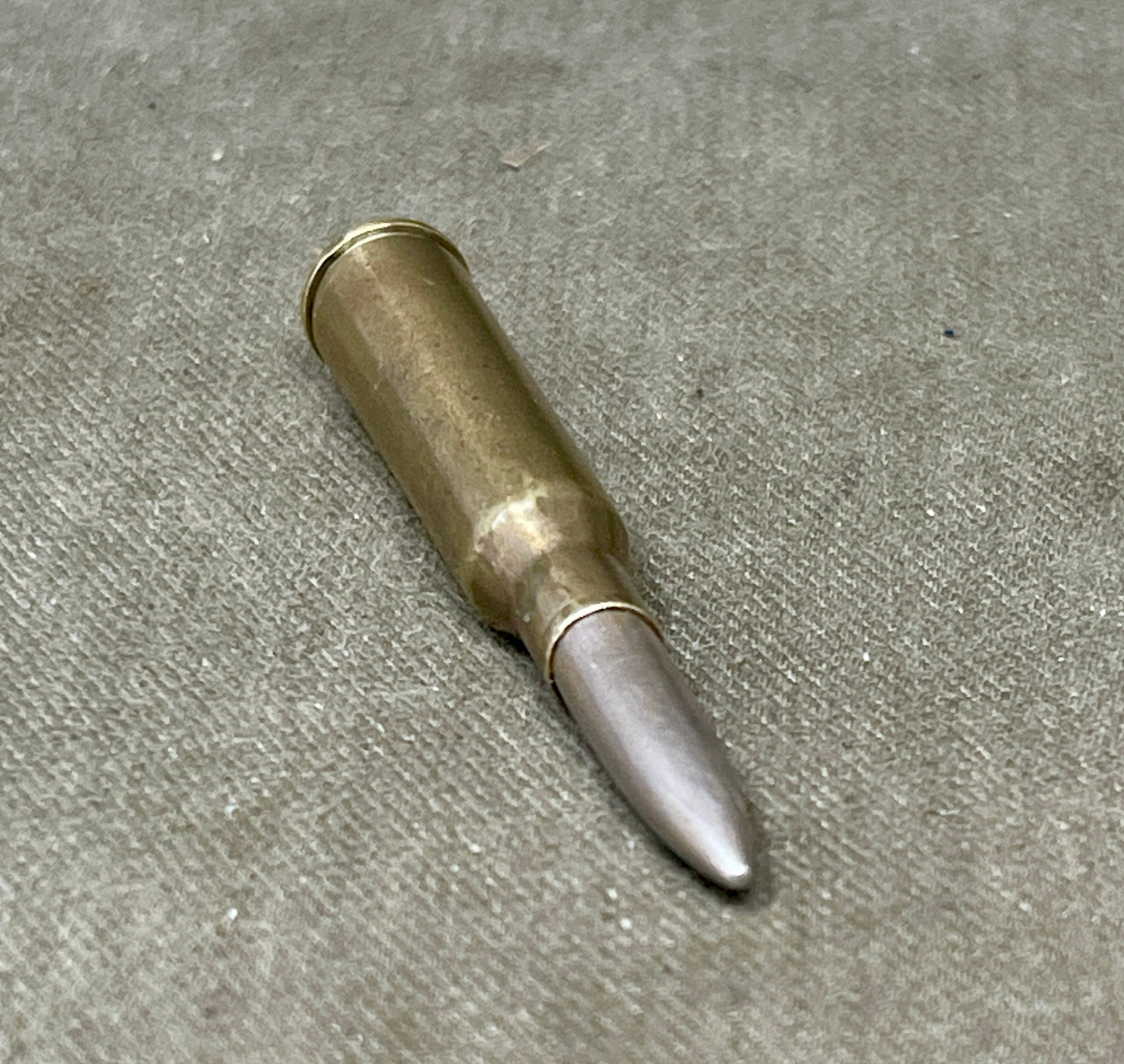 Bulleted cartridge on a concrete surface