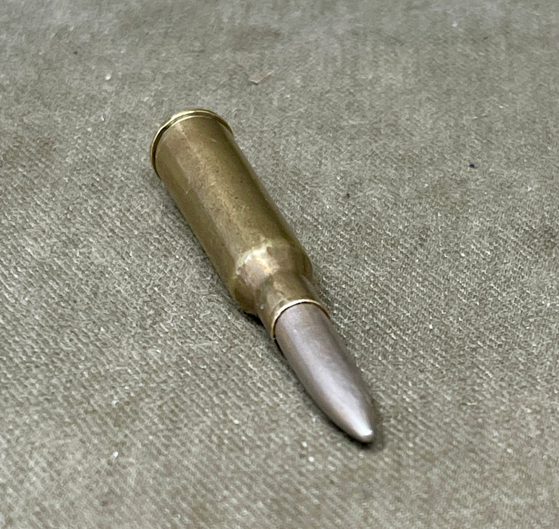 Bulleted cartridge on a concrete surface