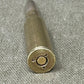 Bullet casing on a textured gray surface