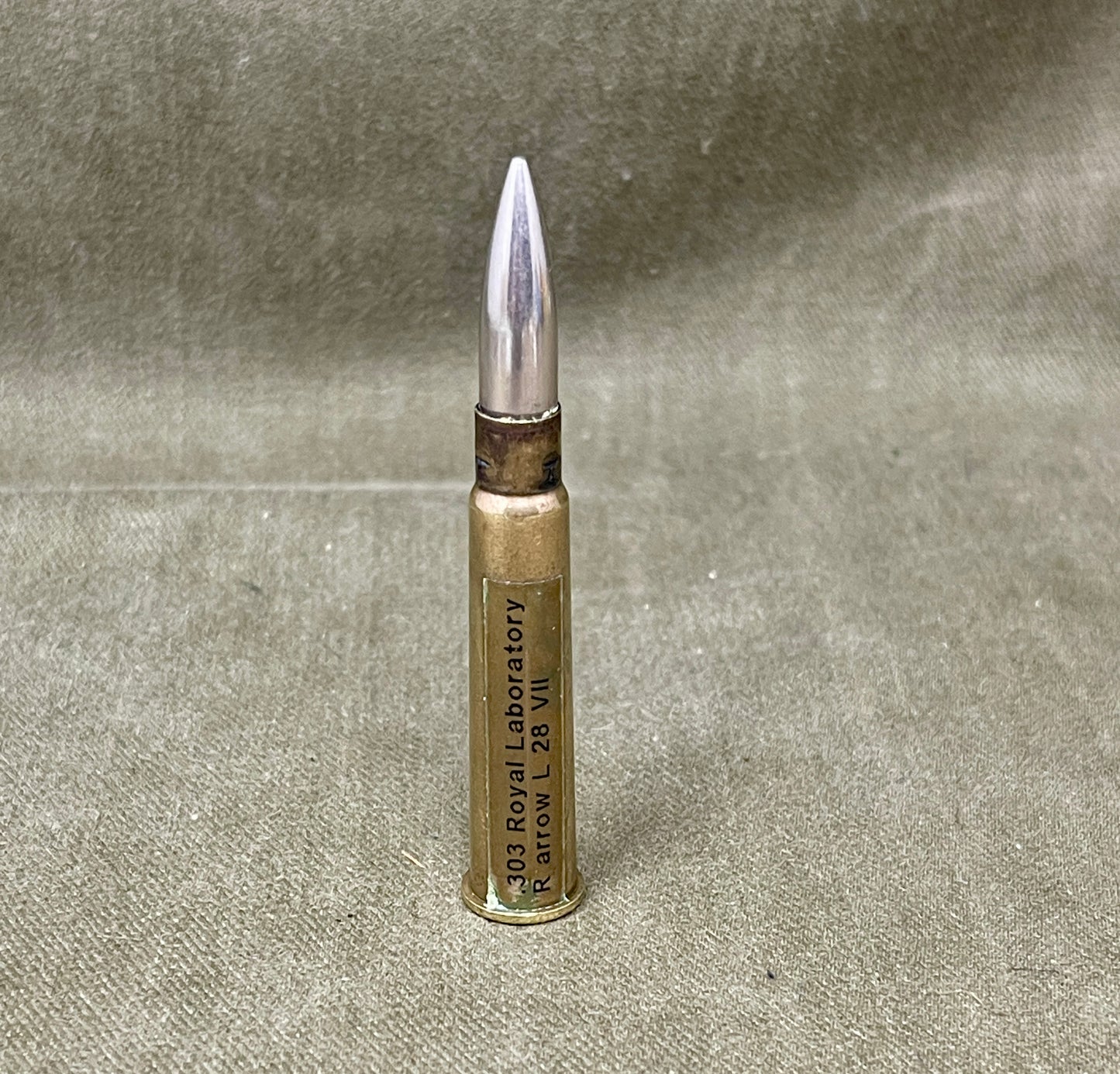 Bullet casing on a textured gray background