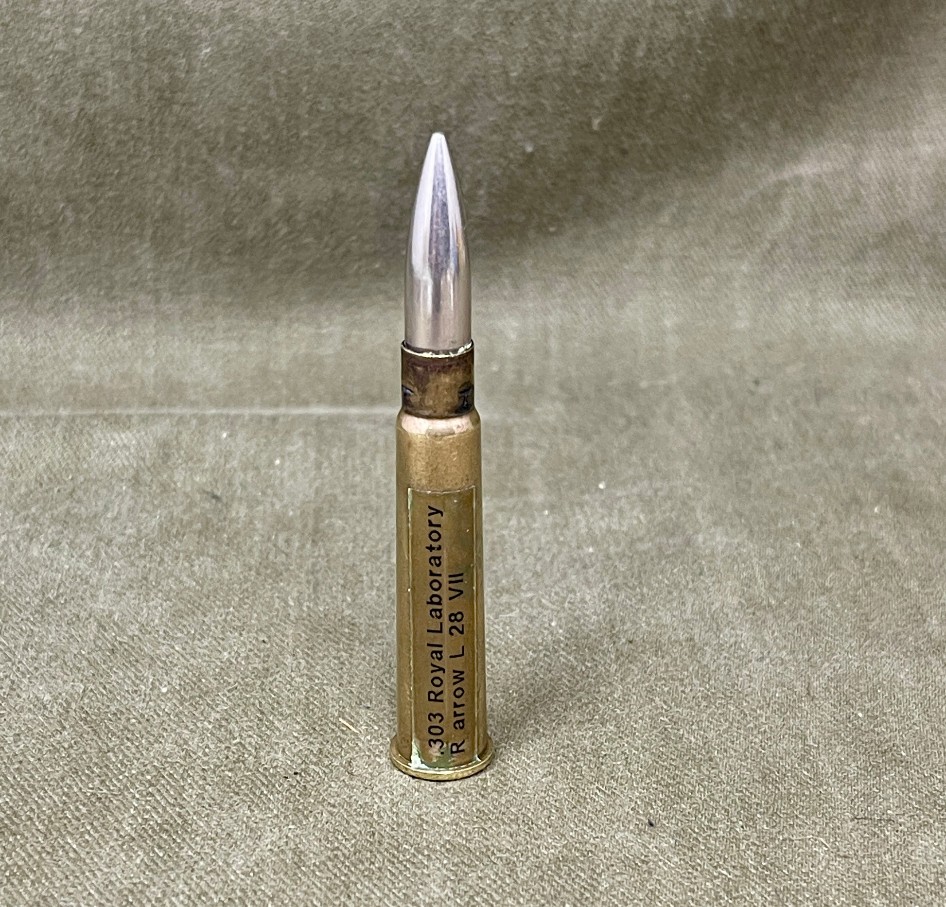 Bullet casing on a textured gray background