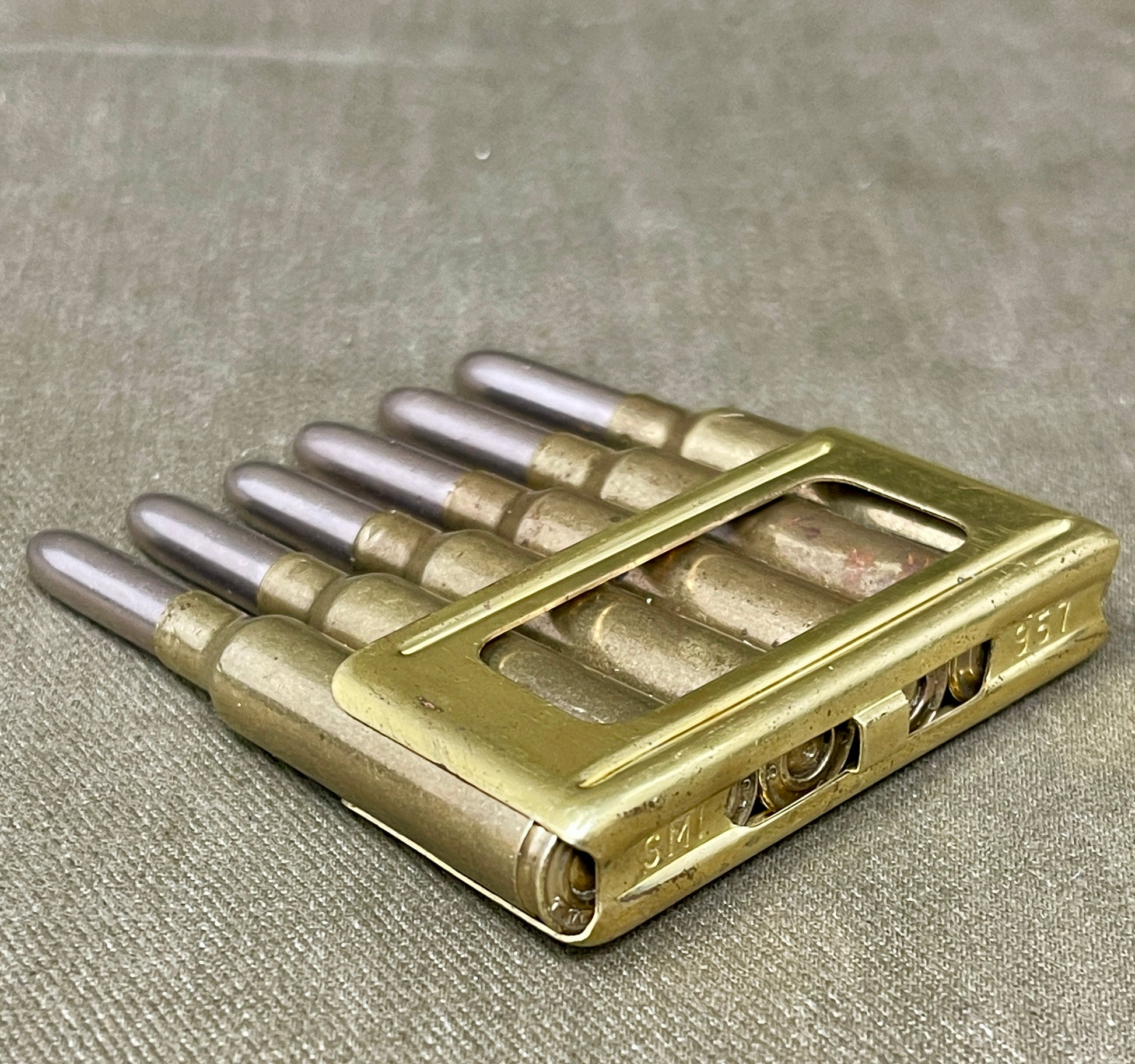 Metallic object with cylindrical components on a textured surface