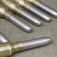 Close-up of rifle cartridges on a textured surface