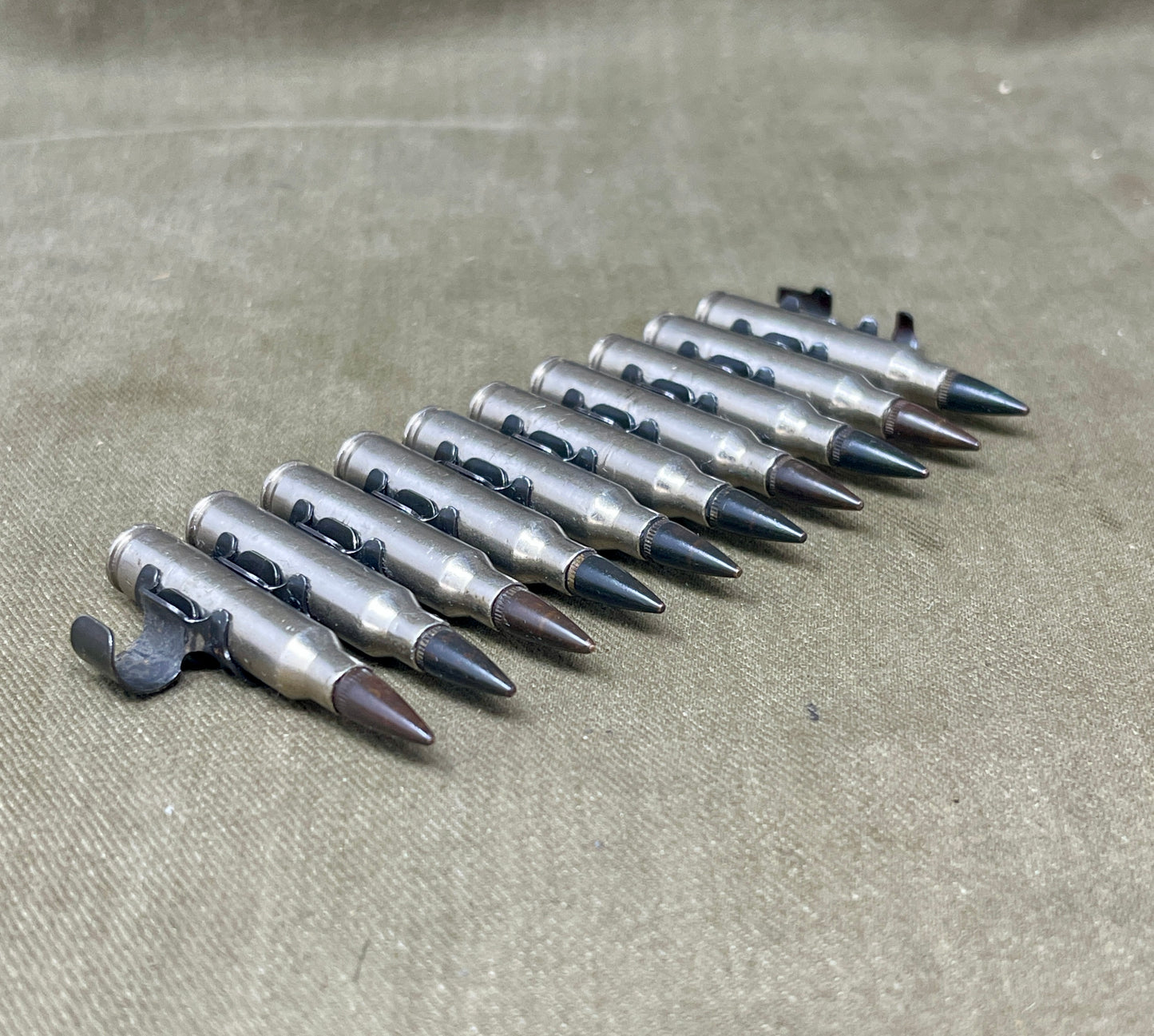 M249 LMG 5.56mm Nickel‑Plated INERT Belt of 10 | Display Ammunition