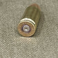 Bullet casing on a textured fabric background