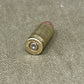 Bullet casing on a textured surface