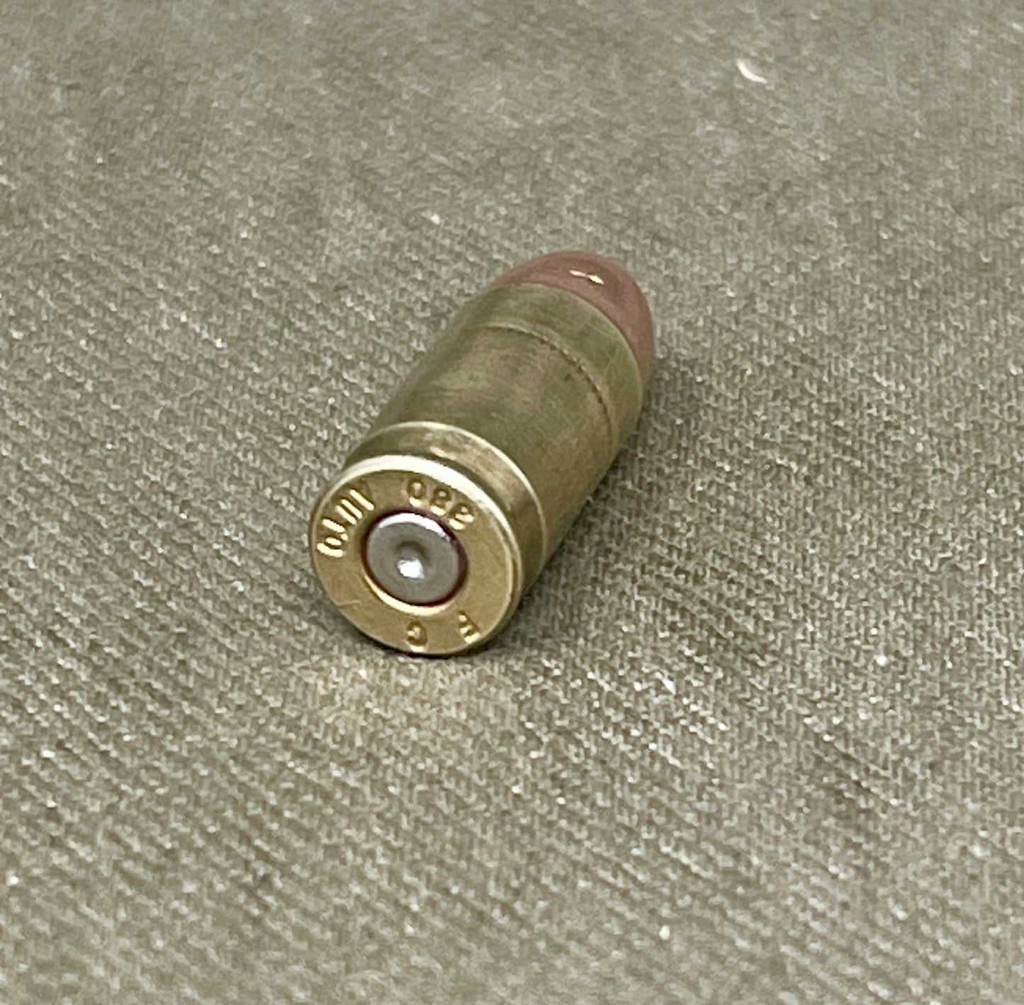 Bullet casing on a textured surface
