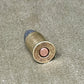Bullet casing on a textured surface