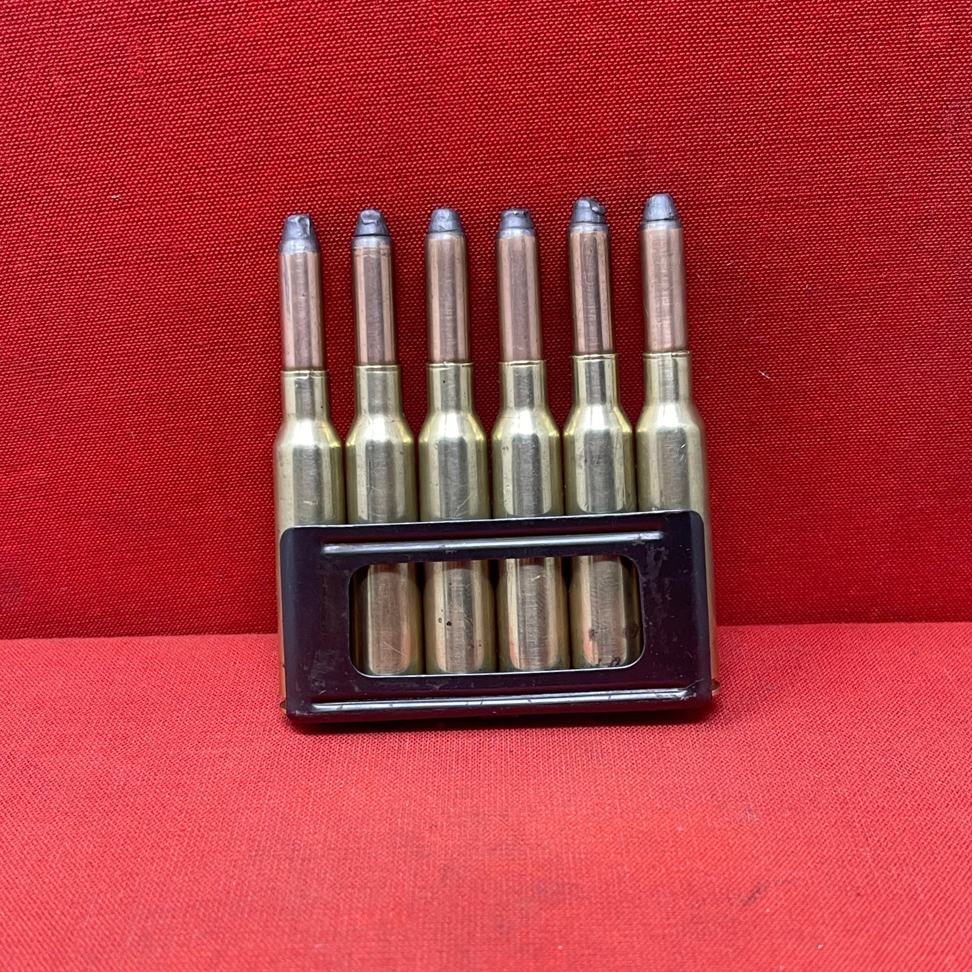 6 x 6.5mm Carcano rounds in clip (inert) (4) (M2)