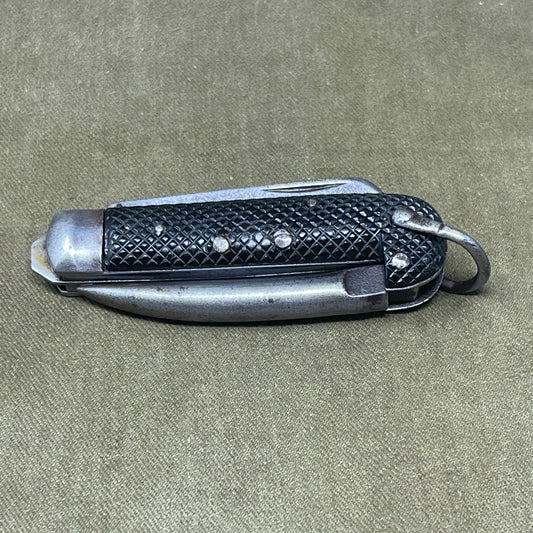 A nice example of a British 1942 Dated Pocket Jack Knife made by Clarke & Son of Sheffield  The blades are in good condition, the chequered Bakelite grip is intact and all the blades lock and close as they should. The steel can opener is in good condition