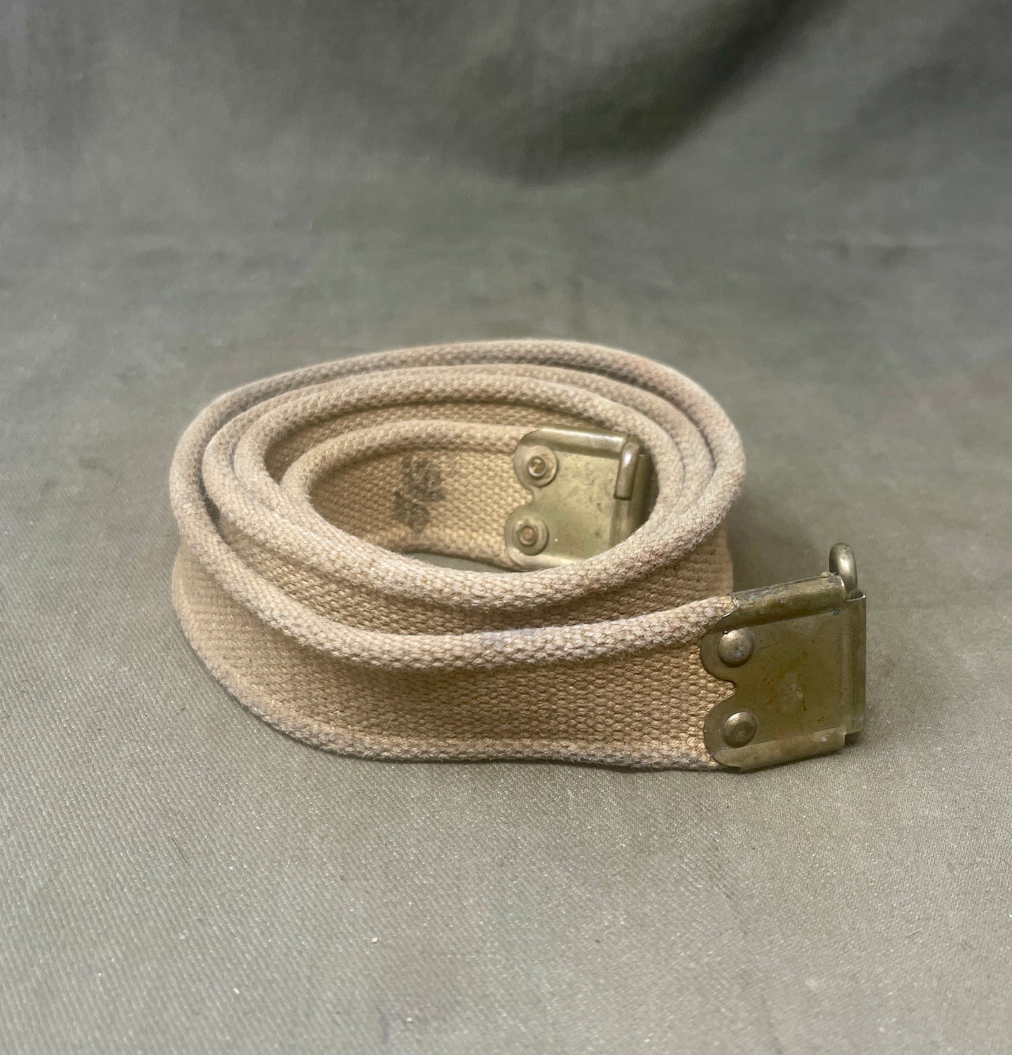 "Discover the WW2 British .303 Enfield rifle sling, a durable and functional accessory for the iconic Lee-Enfield rifle, crafted for comfort and reliability. A must-have collectible for military history enthusiasts."