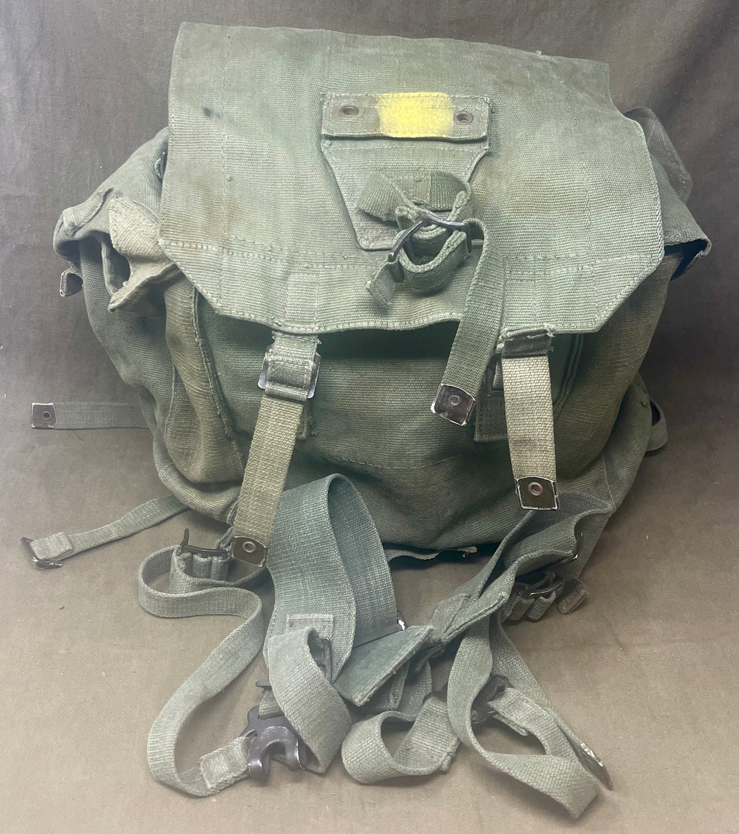 "Explore the 1944 Pattern Small Pack with left and right webbing straps, a durable piece of British military gear from World War II. A must-have collectible for military history enthusiasts."