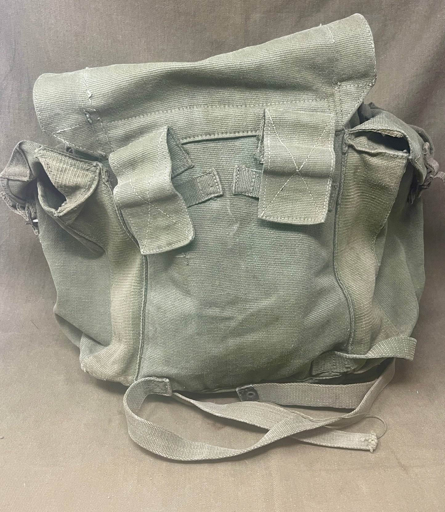 "Explore the 1944 Pattern Small Pack with left and right webbing straps, a durable piece of British military gear from World War II. A must-have collectible for military history enthusiasts."