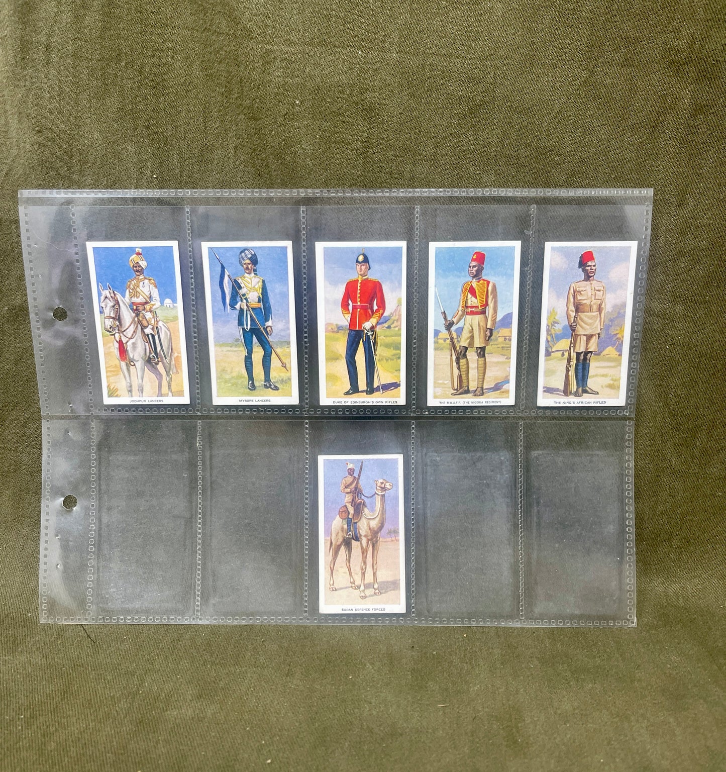 "Explore the Godfrey Phillips Ltd 'Soldiers of the King' cigarette cards, showcasing stunning illustrations and historical insights into British Army regiments. A valuable collectible for military history enthusiasts."