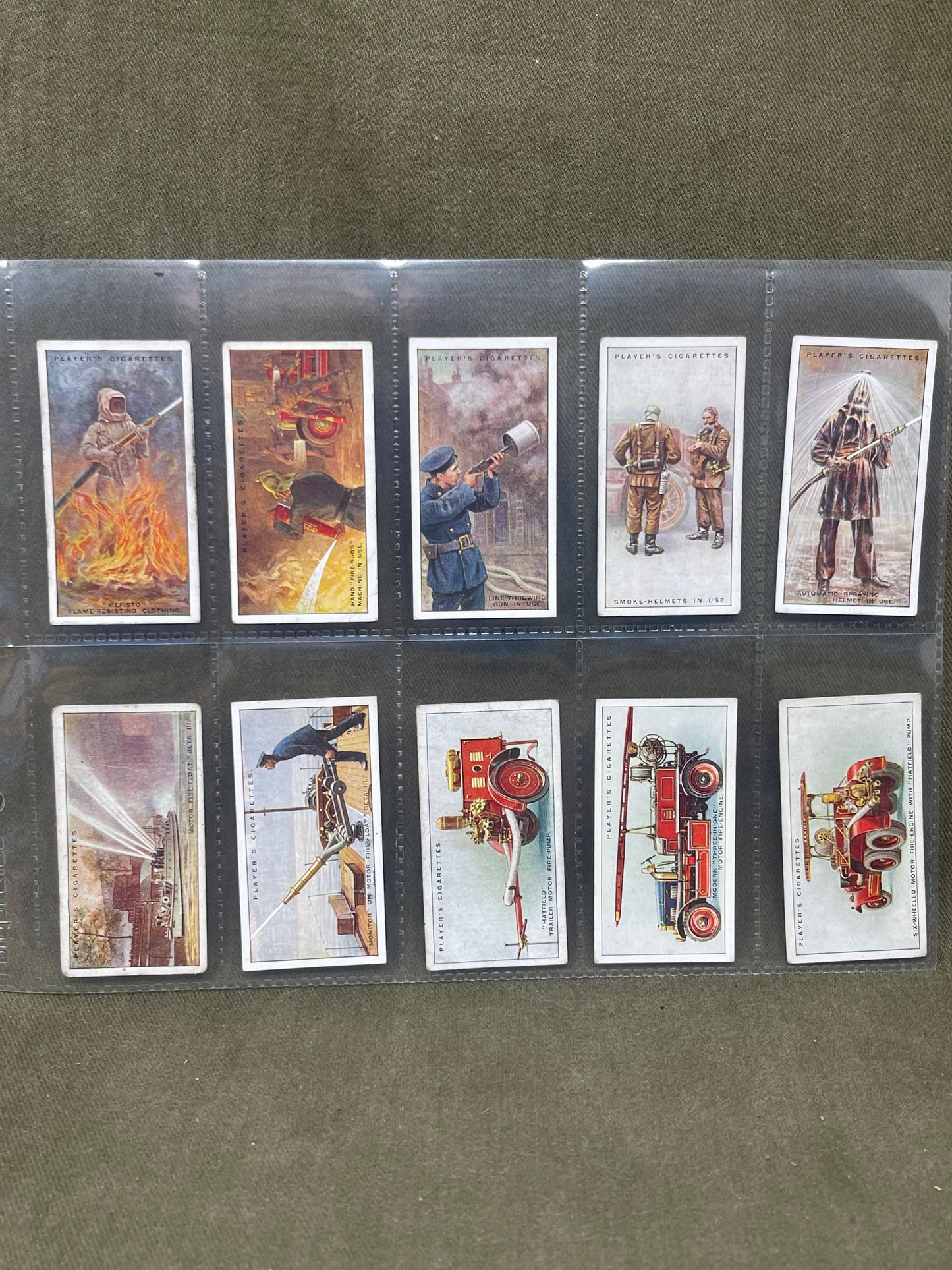 Discover the complete 1936 John Player & Sons "Fire Fighting Appliances" cigarette card set. Featuring 50 detailed cards, this collection showcases various firefighting equipment and techniques, highlighting the evolution of fire safety and the bravery of firefighters